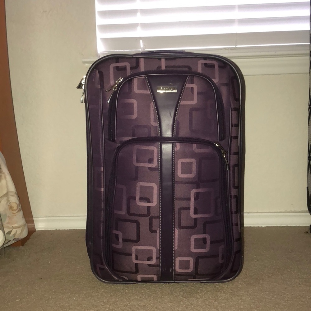 apt 9. purple suitcase